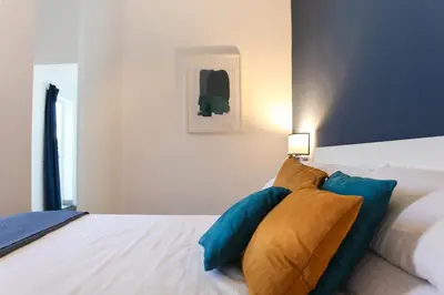 Letto o letti in una camera di Terrazza Manuela Apartments Quartieri Spagnoli