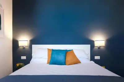 Letto o letti in una camera di Terrazza Manuela Apartments Quartieri Spagnoli