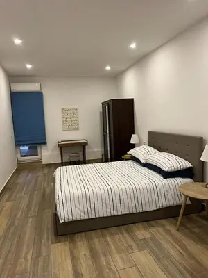 Letto o letti in una camera di Casa Gaia A due passi dal Duomo
