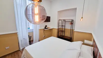 Letto o letti in una camera di La Sciantosa Quartieri Spagnoli