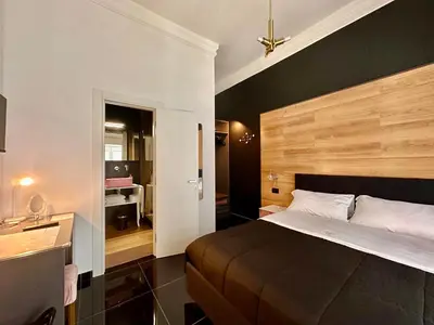 Letto o letti in una camera di Elegance Rooms Spaccanapoli