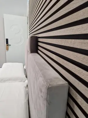 Letto o letti in una camera di WorldwideSuites