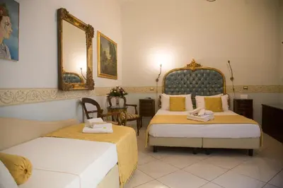 Letto o letti in una camera di B&B Art Suite Santa Brigida