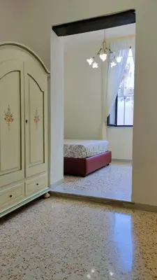 Letto o letti in una camera di LA MASCHERA DI PULCINELLA