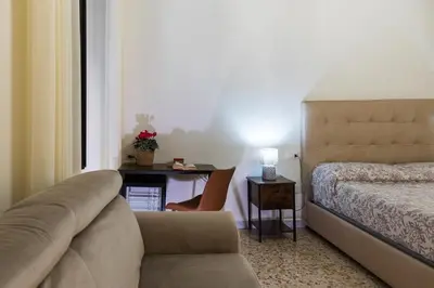 Letto o letti in una camera di LA MASCHERA DI PULCINELLA