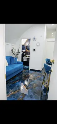 Area soggiorno di Alex mary home