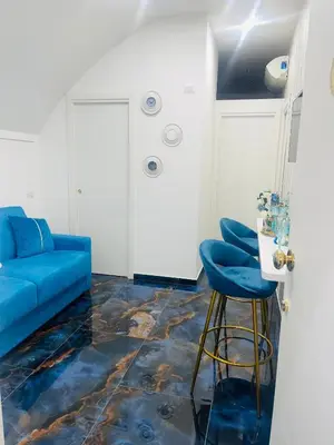 Area soggiorno di Alex mary home