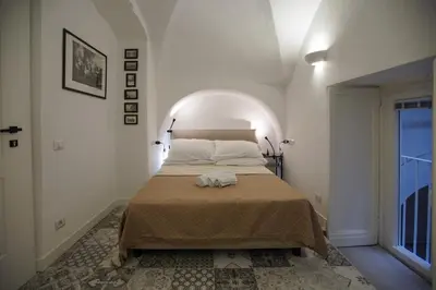 Letto o letti in una camera di Cartoline di Napoli