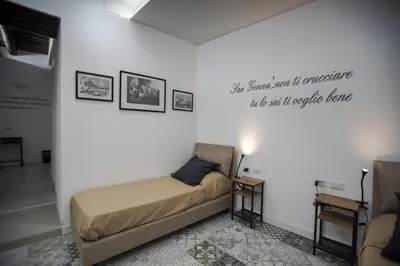 Letto o letti in una camera di Cartoline di Napoli