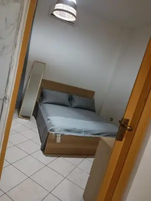 Letto o letti in una camera di Espy Naples