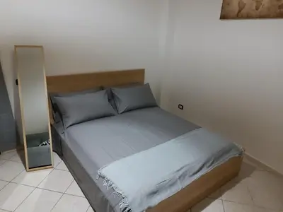 Letto o letti in una camera di Espy Naples
