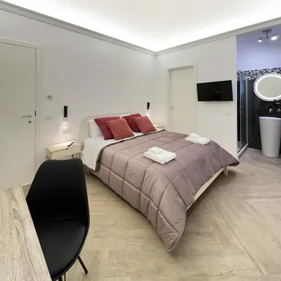 Letto o letti in una camera di VICKI Vomero Rooms - Napoli