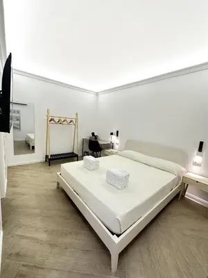 Letto o letti in una camera di VICKI Vomero Rooms - Napoli