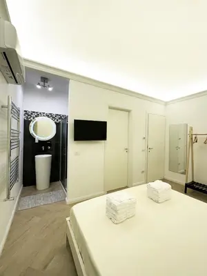 Letto o letti in una camera di VICKI Vomero Rooms - Napoli