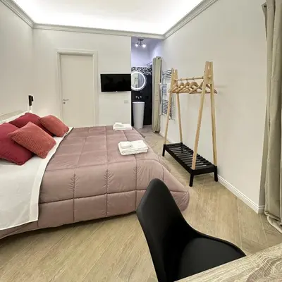 Letto o letti in una camera di VICKI Vomero Rooms - Napoli