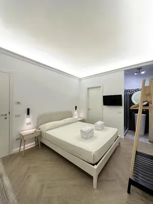 Letto o letti in una camera di VICKI Vomero Rooms - Napoli
