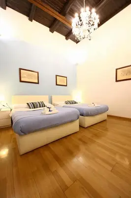 Letto o letti in una camera di Talismano Luxury Rooms & Apartments
