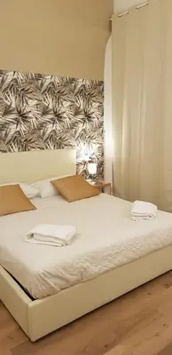 Letto o letti in una camera di Talismano Luxury Rooms & Apartments