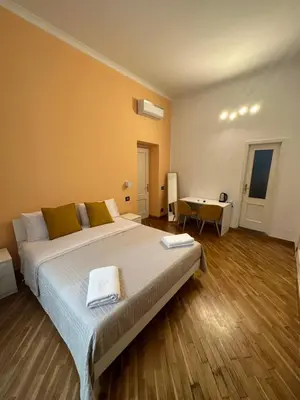 Letto o letti in una camera di Carmè Guest House