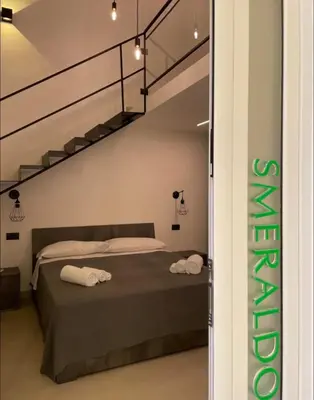 Letto o letti in una camera di B&B Vittoria