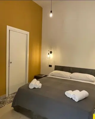 Letto o letti in una camera di B&B Vittoria
