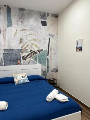 Letto o letti in una camera di Blu Holiday