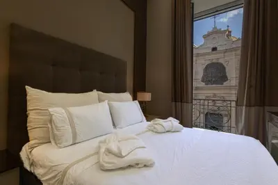 Letto o letti in una camera di luxury and exclusive Bovio square house