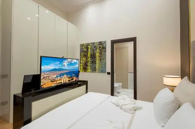 Letto o letti in una camera di luxury and exclusive Bovio square house