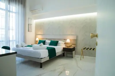 Letto o letti in una camera di Lagi Suites