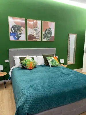 Letto o letti in una camera di Vomero Suite and Deluxe Room B&B Napoli