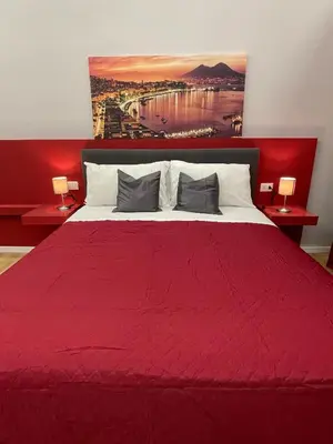 Letto o letti in una camera di Vomero Suite and Deluxe Room B&B Napoli