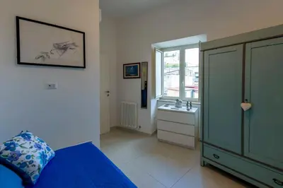 Letto o letti in una camera di The Roof of Naples