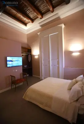 Letto o letti in una camera di San Paolo Rooms Centro Storico Napoli