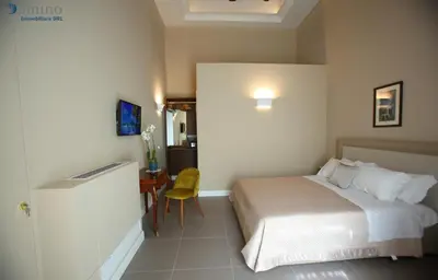 Letto o letti in una camera di San Paolo Rooms Centro Storico Napoli