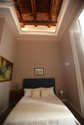 Letto o letti in una camera di San Paolo Rooms Centro Storico Napoli