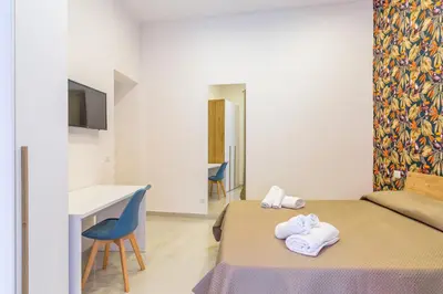 Letto o letti in una camera di Toledo House Apartments