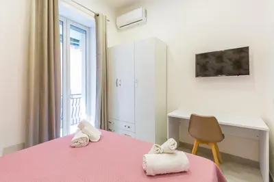 Letto o letti in una camera di Toledo House Apartments