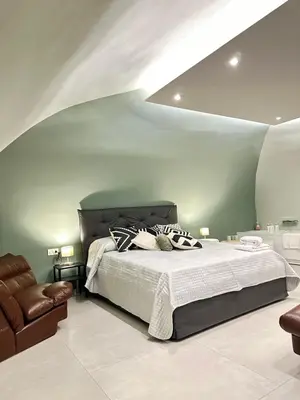 Letto o letti in una camera di CARMA SUITE