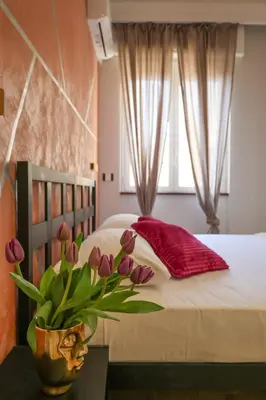 Letto o letti in una camera di Cuore Napoli Centro