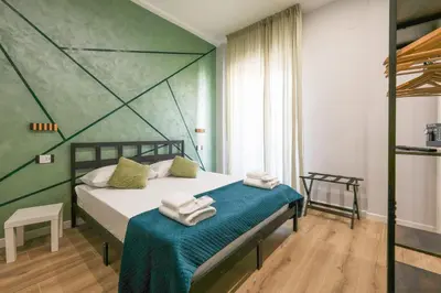 Letto o letti in una camera di Cuore Napoli Centro