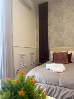 Letto o letti in una camera di DOMUS LUIGI LEONE 2