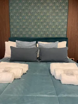 Letto o letti in una camera di DOMUS LUIGI LEONE 2
