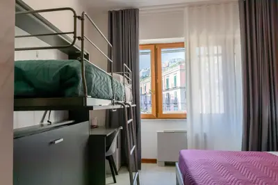 Letto o letti in una camera di May Flower Luxury