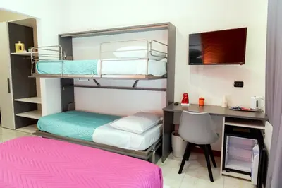 Letto o letti in una camera di May Flower Luxury