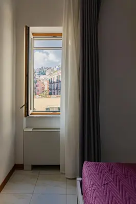 Letto o letti in una camera di May Flower Luxury