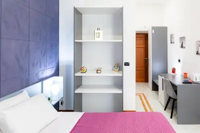 Letto o letti in una camera di May Flower Luxury