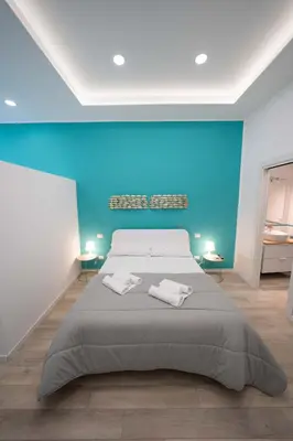 Letto o letti in una camera di Residenza Pugliese - Golfo di Napoli By Dimorra