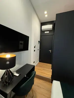 TV o dispositivi per l'intrattenimento presso Materdei Emerald Rooms