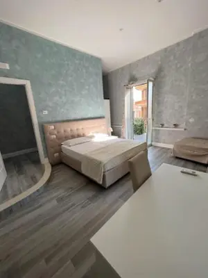 Letto o letti in una camera di Gioia Toledo