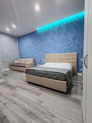 Letto o letti in una camera di Gioia Toledo